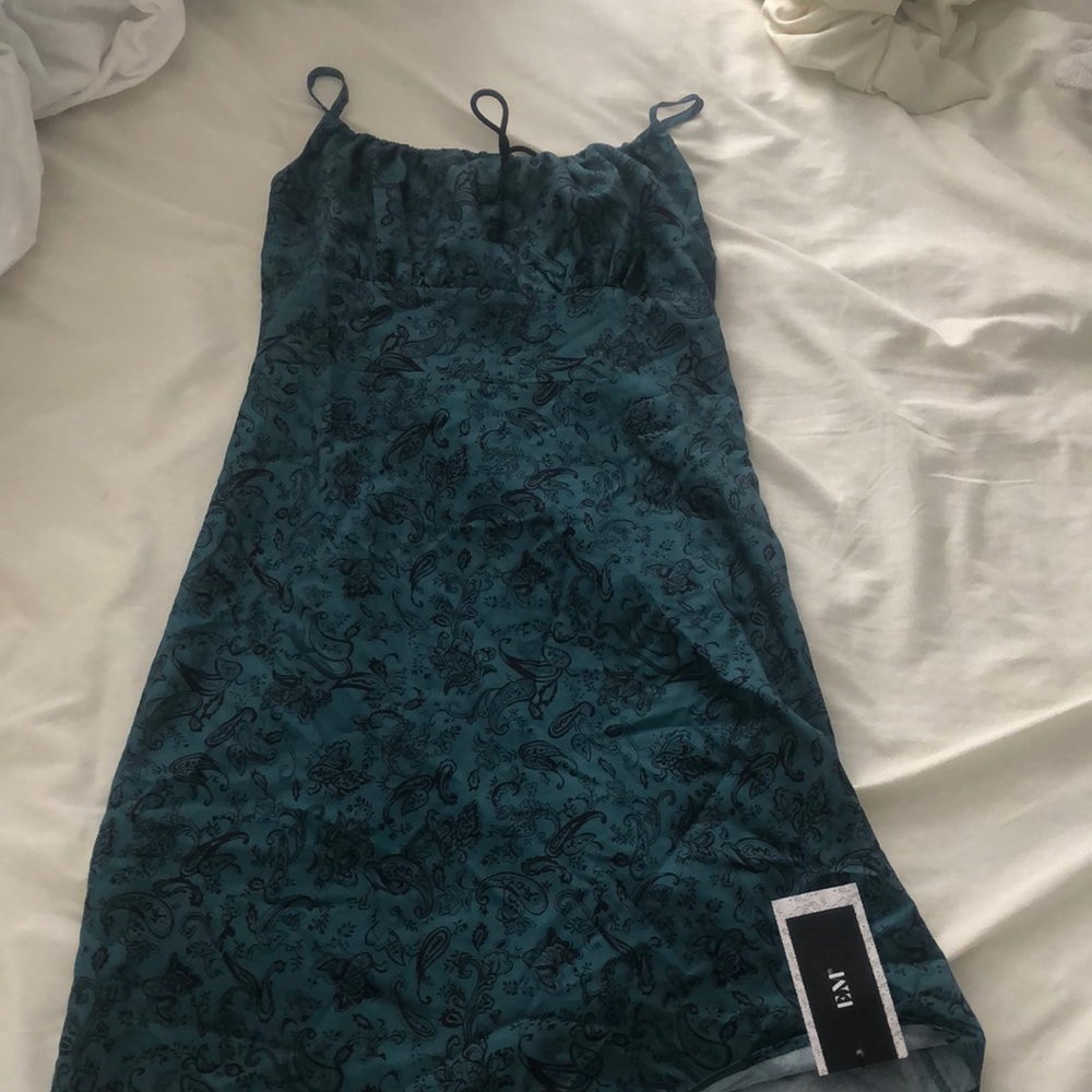 A dress that’s synchs at the top with a tie